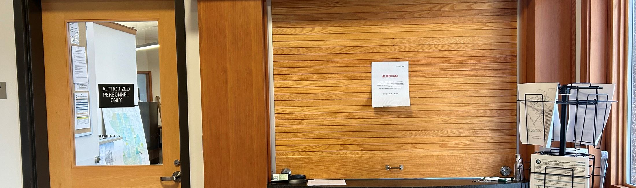 Image of the contractor counter at the District offices, with the window closed for business.